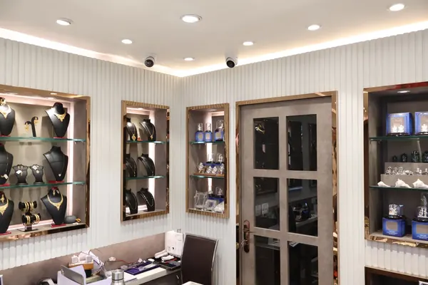 Showroom corner with gold jewellery and silver idol displays